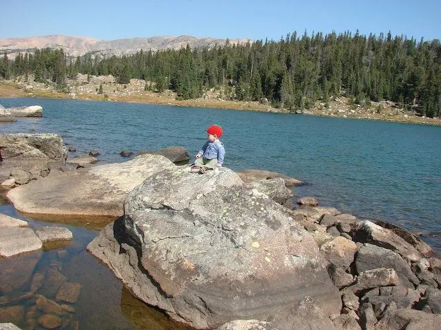 A baby on a rock in Night Lake A baby on a rock in Night Lake